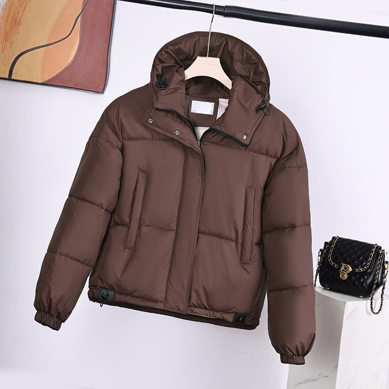 Women's padded hooded jacket with a boxy fit and concealed placket