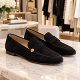 Noira black suede loafers displayed in the Jennifer Dallas Boutique shoe section