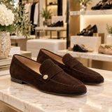 Noira Dark Brown suede loafers displayed in the Jennifer Dallas Boutique shoe section