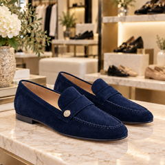 Noira Navy Blue suede loafers displayed in the Jennifer Dallas Boutique shoe section